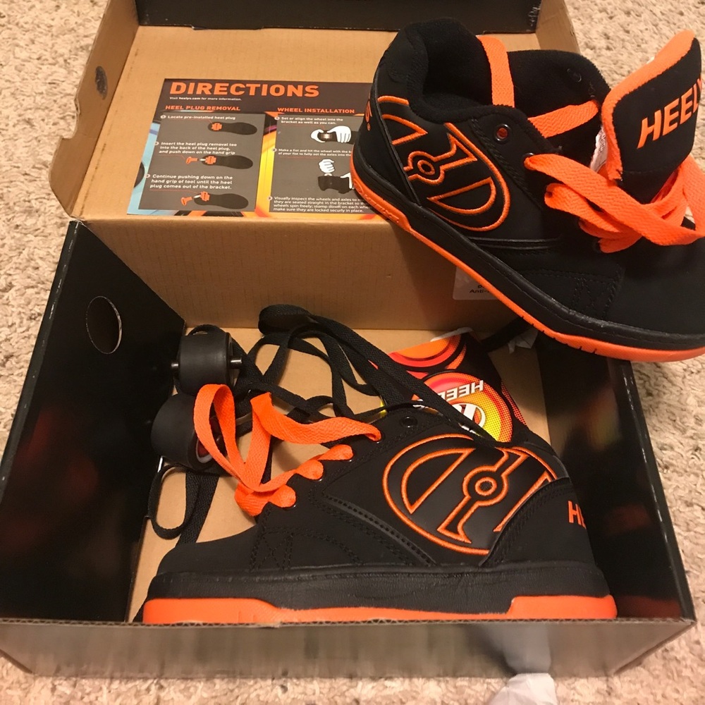 NEW in box!   Heelys Orange and Black shoes
