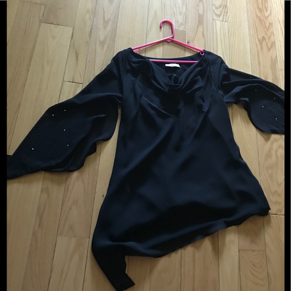 Black with sequins on the sleeves