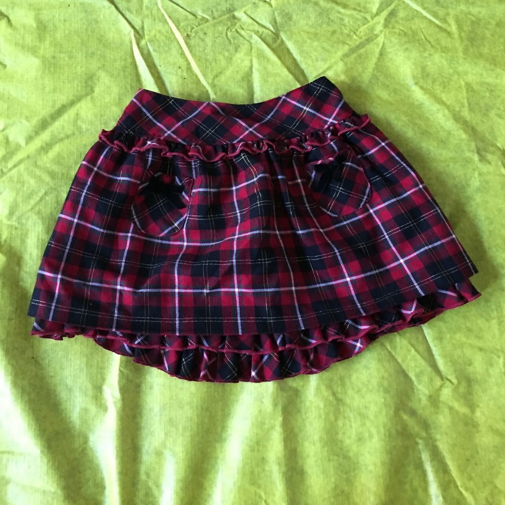 Lightly used Maggie and Zoe plaid toddler skirt.