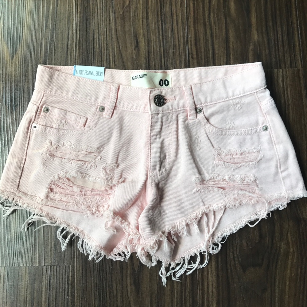 Light pink distressed shorts