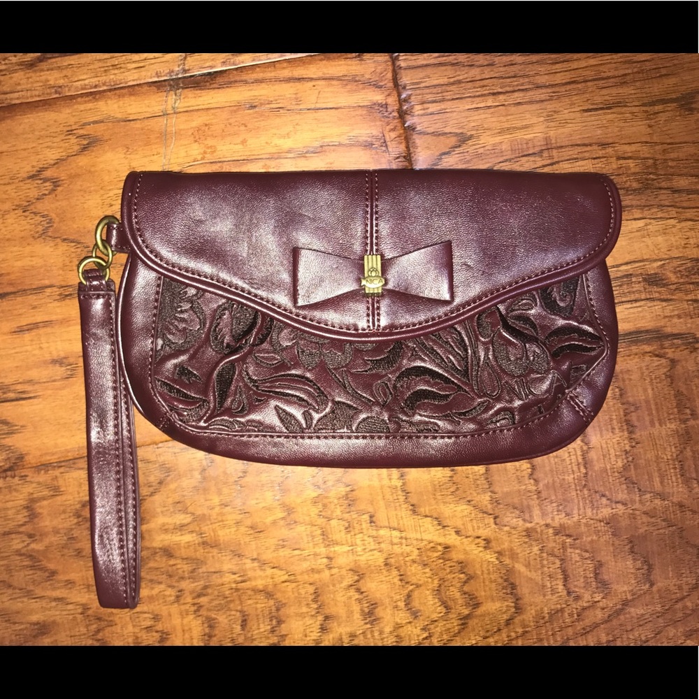 Burgundy clutch with snap closure