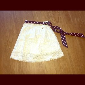 White lace skirt with polka dot belt