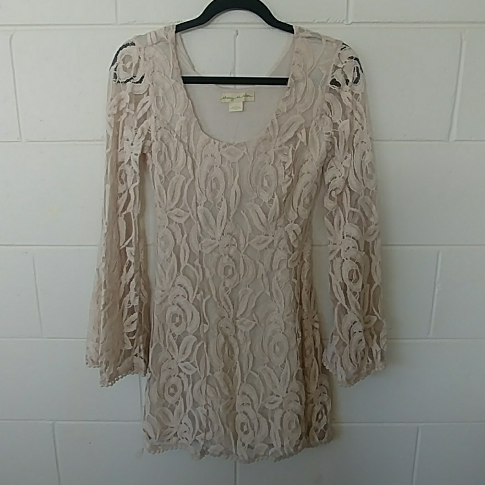 Cream colored long sleeved lace dress