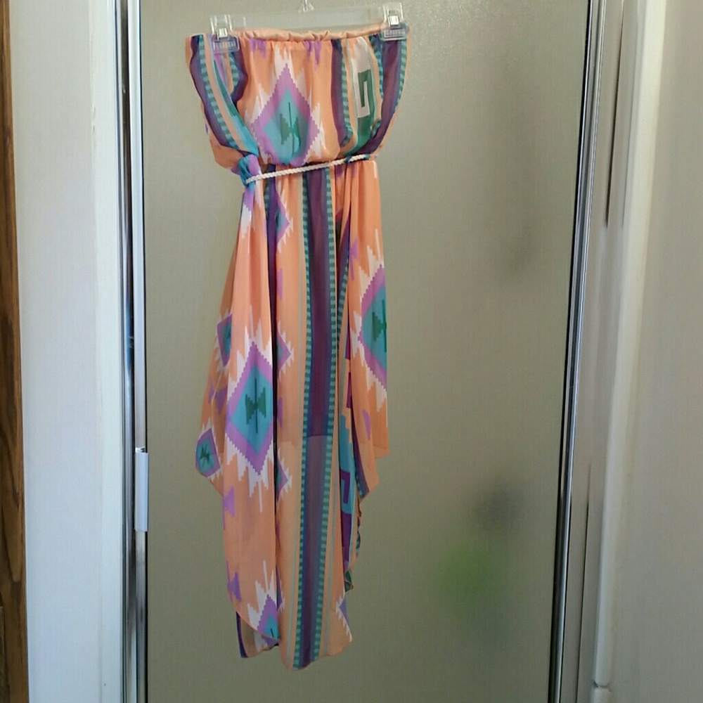 Get ready for summer with this strapless southwest print dress.