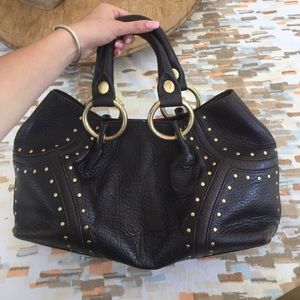 Leather handbag with gold metal