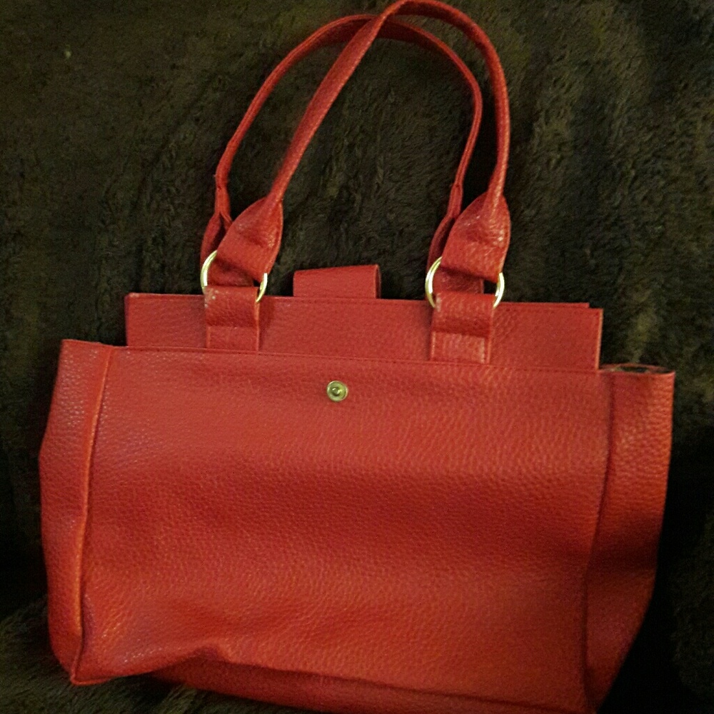 Red leather like bag with zebra lining