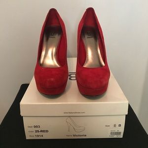 Red suede pumps