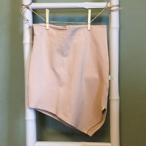 Formfitting beige asymmetrical skirt