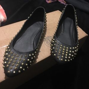 Black spiked pointed-toe flats