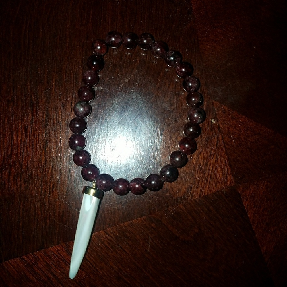 Garnet crystal bead bracelet with horn charm