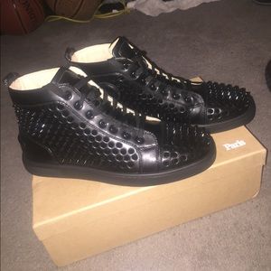 Christian louboutin red bottom spiked sneakers.