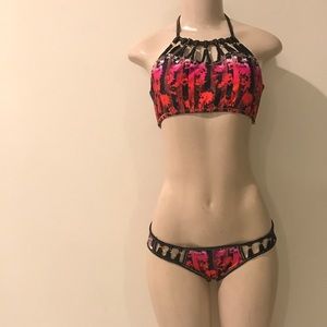 Elegant swimsuit. Pink, red and black.