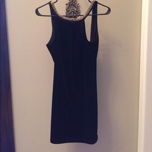 velvet dress with low back and gold jewel detail