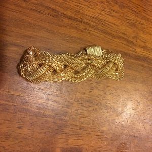 Pretty gold colored metal braided bracelet