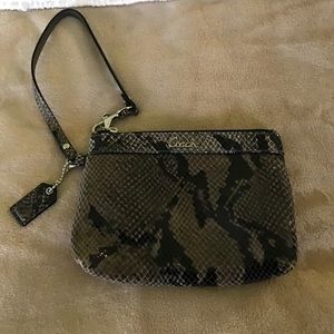 Never carried!! Coach snake skin wristlet