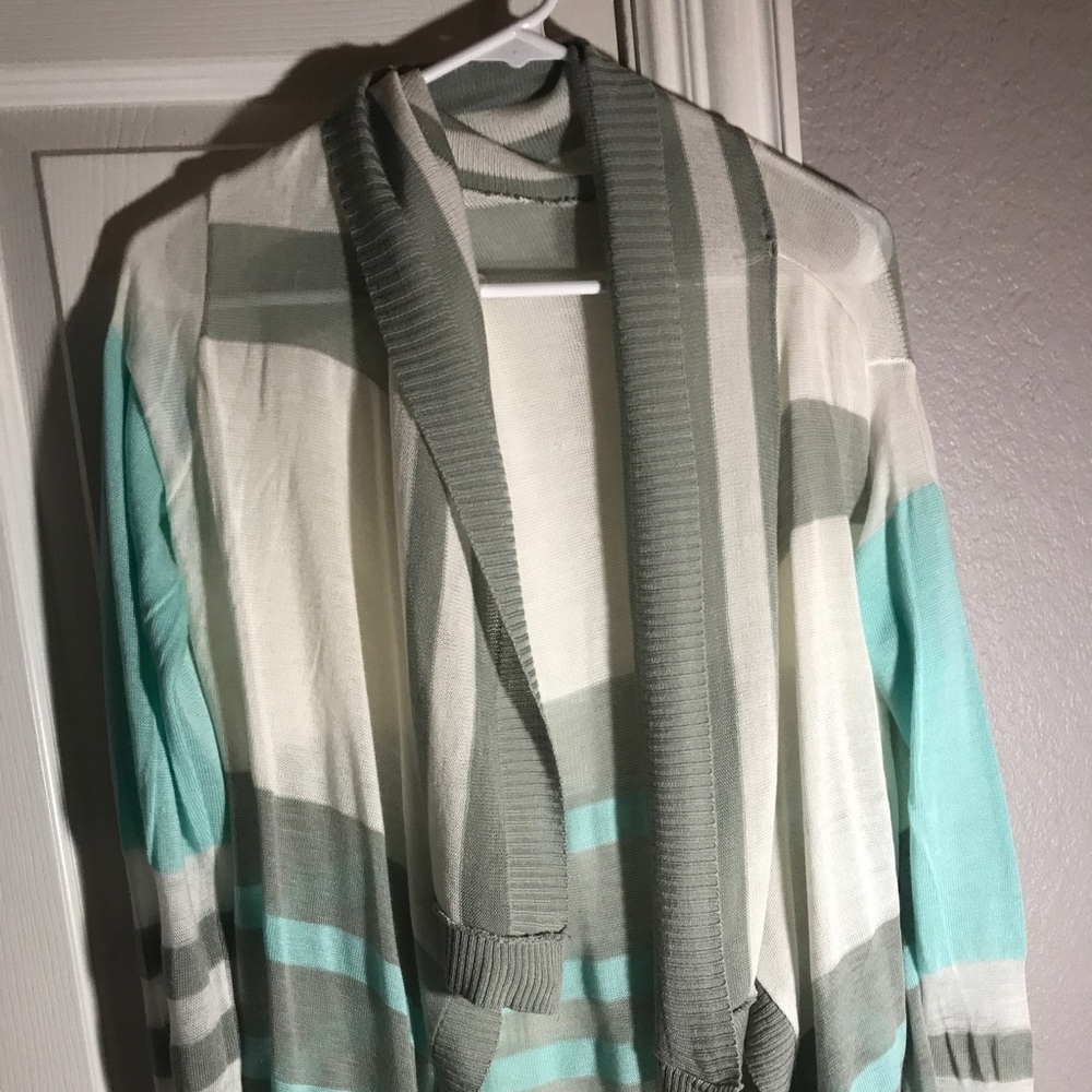 Grey, white, and mint/blueish cardigan.