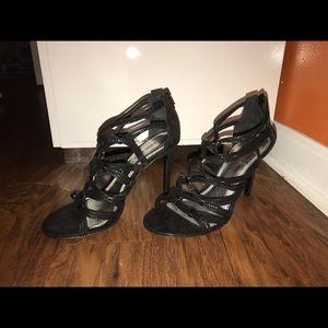 A black pair of Gianni Bini heels.