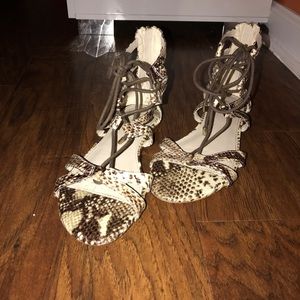 A pair of Aldo sandals.