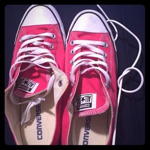 Raspberry colored low top converses