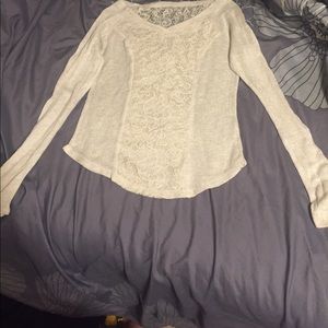 It's a long sleeved cream shit