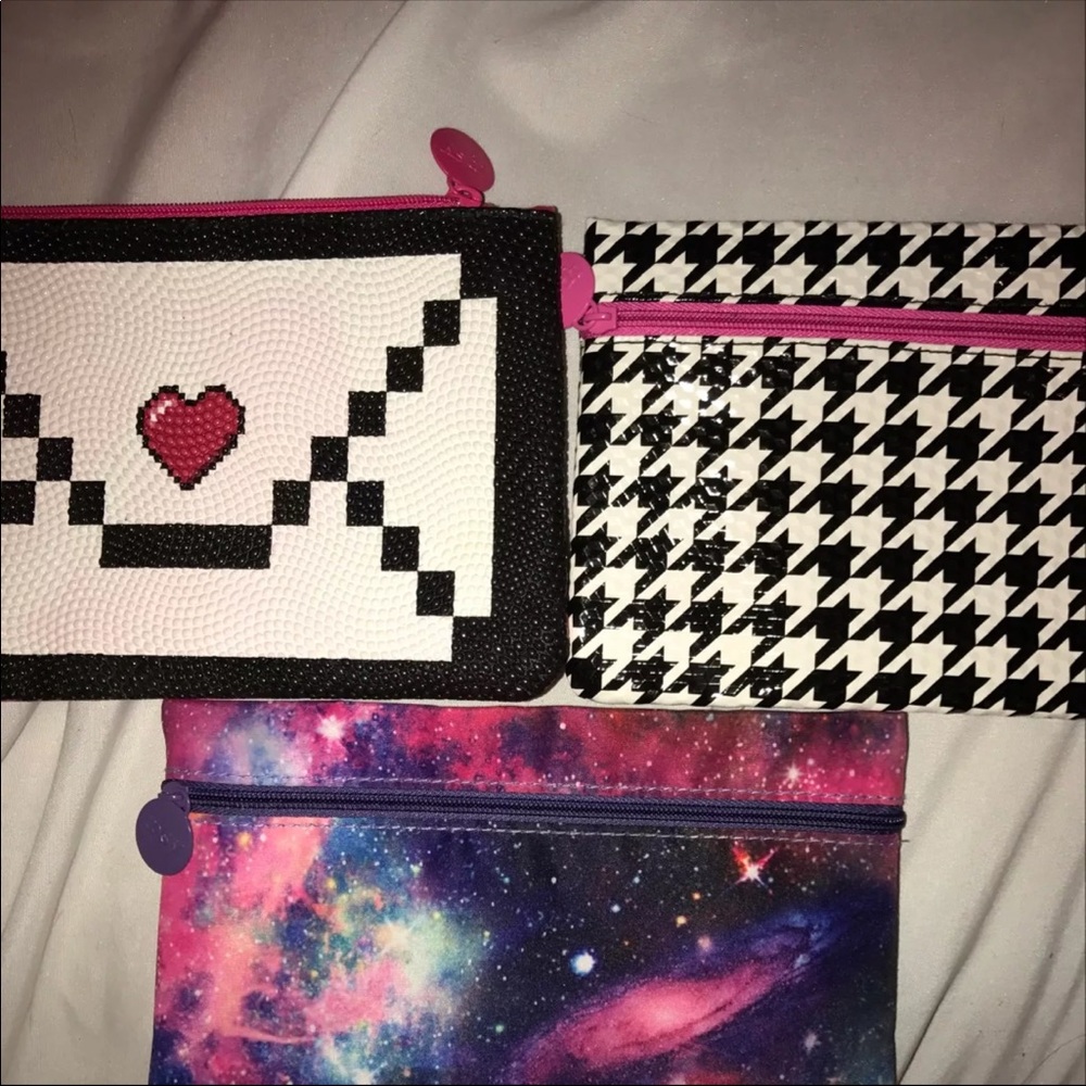 3 ipsy makeup bags with a surprise in each bag