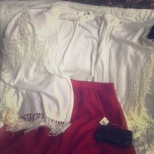 Flowy-puffy red skirt, with white tassel shaw.