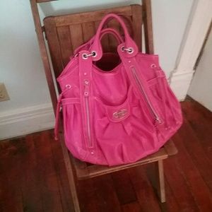 Pink bag, slightly used. Fun zipper compartments!