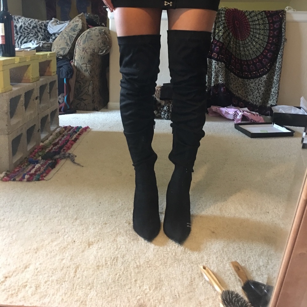 Thigh high heeled boots