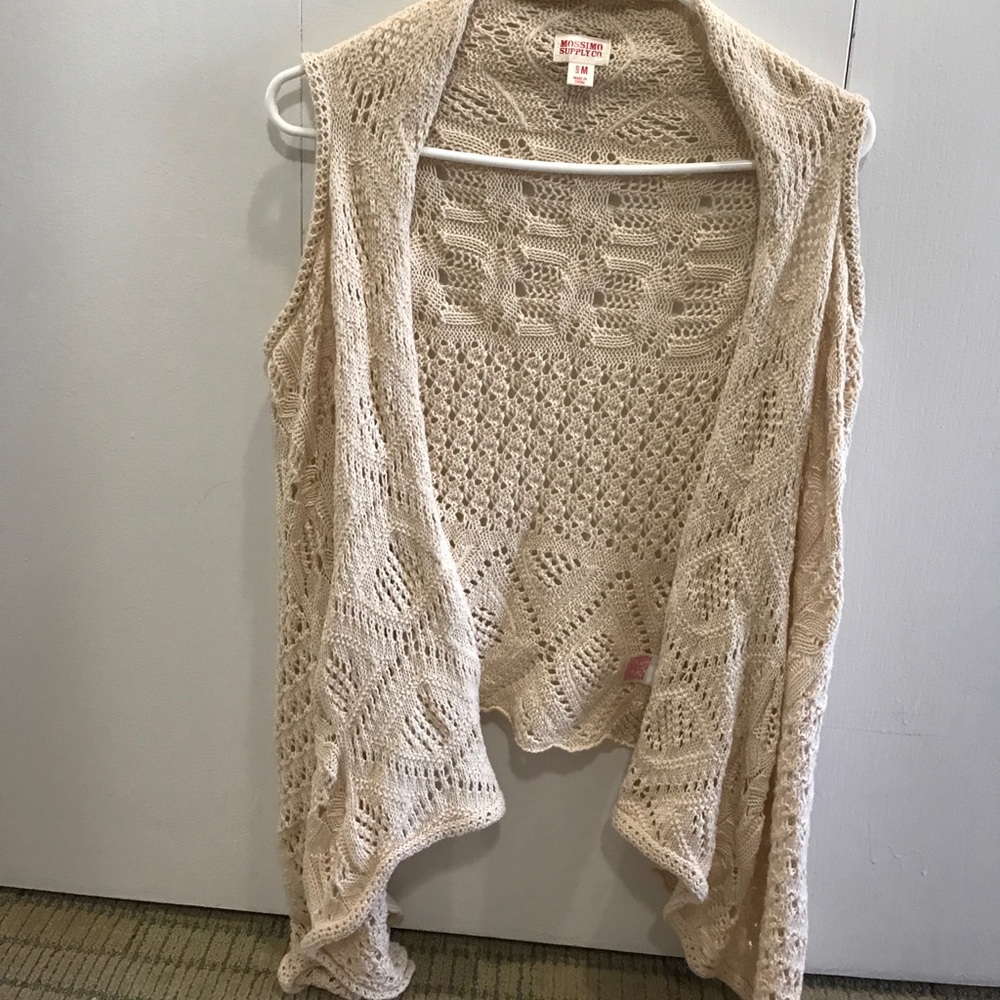 Cream knit vest.