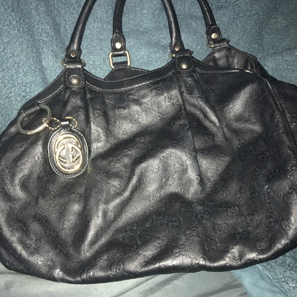 Black leather embossed Gucci bag