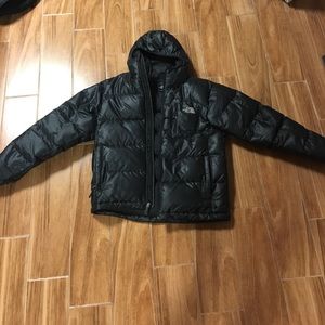 A black North Face puffy winter jacket