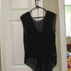 Sheer black top trimmed in tan