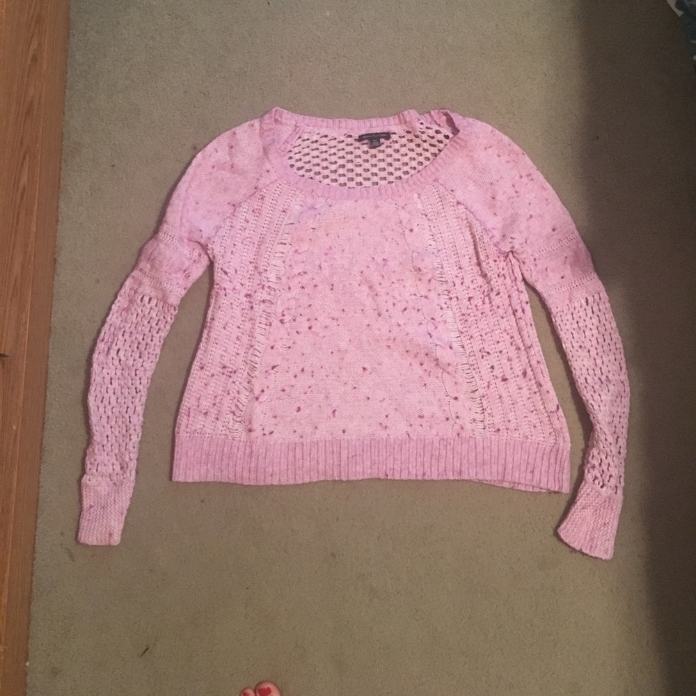 Pink sweater with whole design in back and sleeves