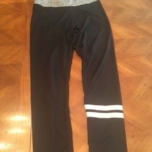 Black leggings with stripes on one leg