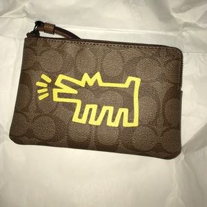 NWT coach wristlet/ yellow graphic Keith Haring.