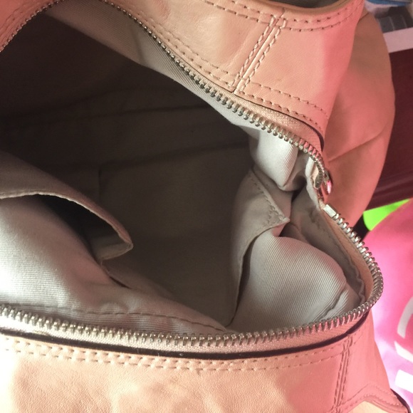 A peach colored purse. - Picture 4 of 5