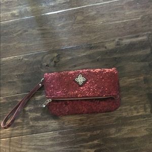 Cranberry colored wristlet with sequins