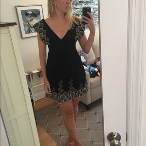 Black capped-sleeves dress with details