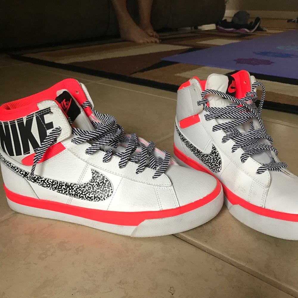 Neon pink and white nike sneakers