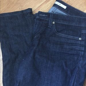 Dark blue jeans w/ some sheen