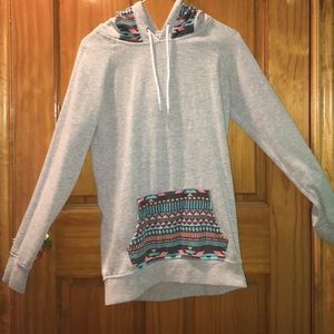 Small grey hoodie with colorful patterns