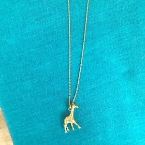 Long gold giraffe charm necklace