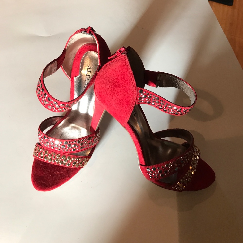 Red suede with silver bullet accents. Worn once