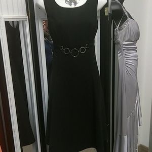 BLACK Dress with silver chain in front. Knee lengt