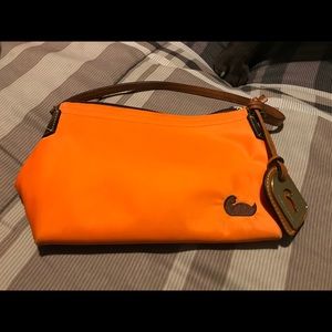 New mini Dooney and Burke orange. New but no tags