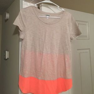 Express creme and pinkish/orange top