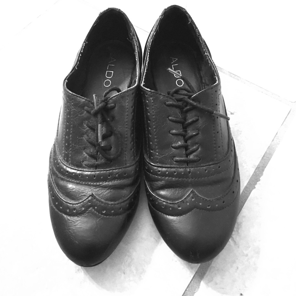 Black tied up flats