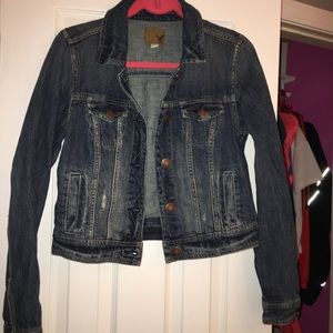 Denim jacket. Slightly distressed style.