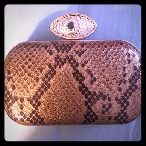 In's snakeskin evil eye gold clutch