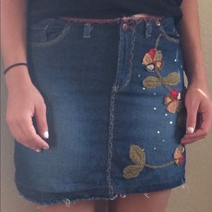 Super cute embroidered mini skirt from BEBE